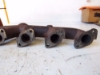 Picture of Kubota 17393-12310 Exhaust Manifold F2803 Engine M4700 Tractor