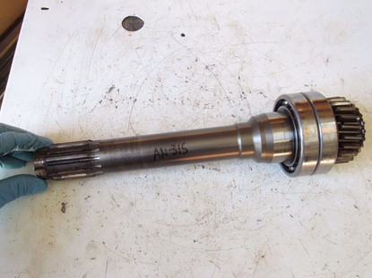 Picture of Kubota 3A011-28090 Shaft 21T to Tractor (see nicks in teeth)