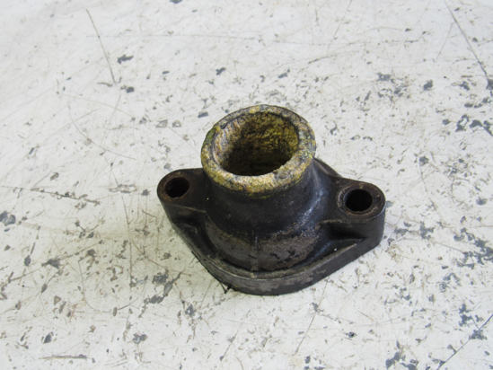 Picture of Bobcat Straight Thermostat Cover interchanges w/ 6599245 off Perkins 4.154 Engine