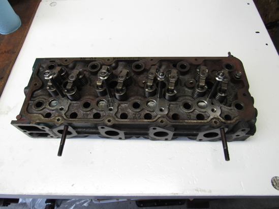 Picture of Kubota 1J705-03030 Cylinder Head NEEDS WORK off V2607-CR-T-EF08 1J705-03032