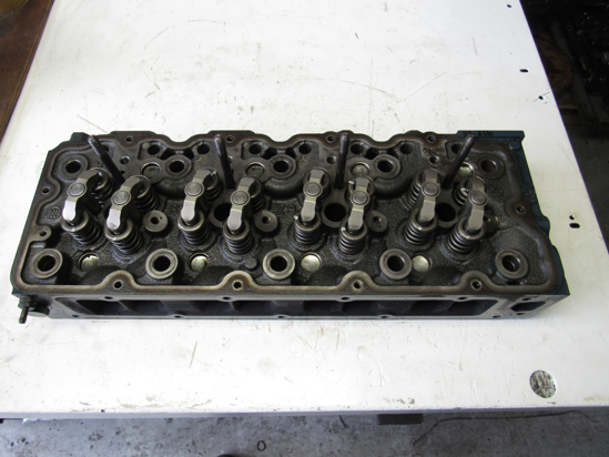 Picture of Kubota 1J770-03030 Cylinder Head w/ Valves to certain V3307 engine 1J770-03034 1J770-03035 1J775-03030
