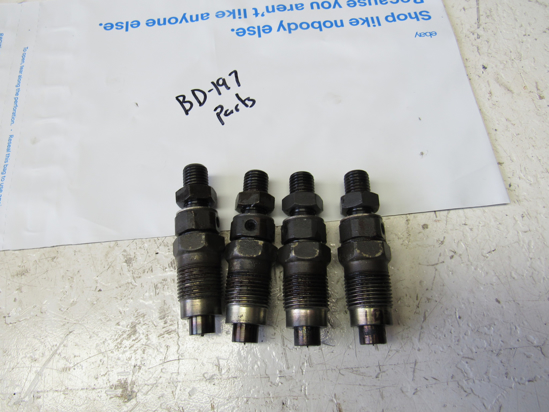 Picture of 4 Kubota 16419-53900 Fuel Injectors to certain V2403-M engine FOR PARTS 16419-53905