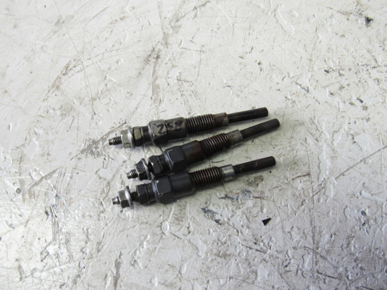 Picture of 3 Kubota 16281-65510 Glow Plugs off D1105-E