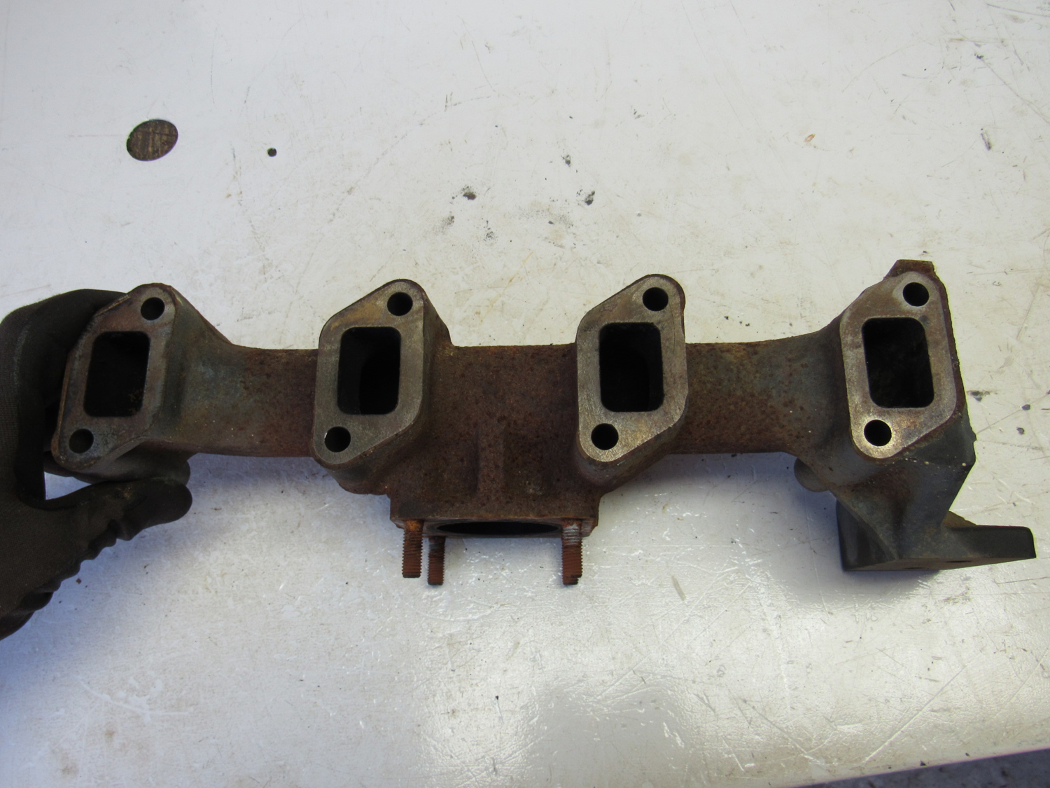Eastern Triangle Enterprises LLC EStore. Exhaust Manifold off Yanmar 4TNV88BDSA2 Diesel Engine
