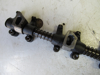 Picture of John Deere T20465 R54986 Rocker Arm Shaft Assy AT31250 T20315 DD12121 RE19031