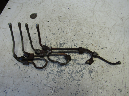 Picture of Case H411140 H411165 H411173 H411199 Fuel Injector Lines Pipes off Mitsubishi 4DQ5 DH4B Trencher