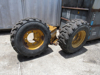 Picture of 2 John Deere AT178499 AT309105 Wheels 16.5x9.75 w/ Carlisle 12-16.5 Tires off 300D Backhoe