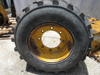 Picture of 2 John Deere AT178499 AT309105 Wheels 16.5x9.75 w/ Carlisle 12-16.5 Tires off 300D Backhoe