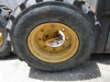 Picture of 2 John Deere AT178499 AT309105 Wheels 16.5x9.75 w/ Carlisle 12-16.5 Tires off 300D Backhoe
